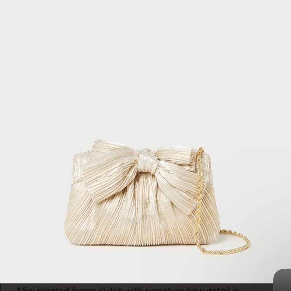 NWT Loeffler Randall bow platinum mini clutch